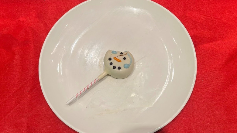 Starbucks snowman cake pop on a white plate