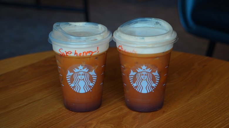 Bird's eye view of Starbucks' Caramel Aerocano and Aerocano (left to right).
