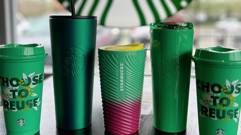 Several Starbucks reusable cups
