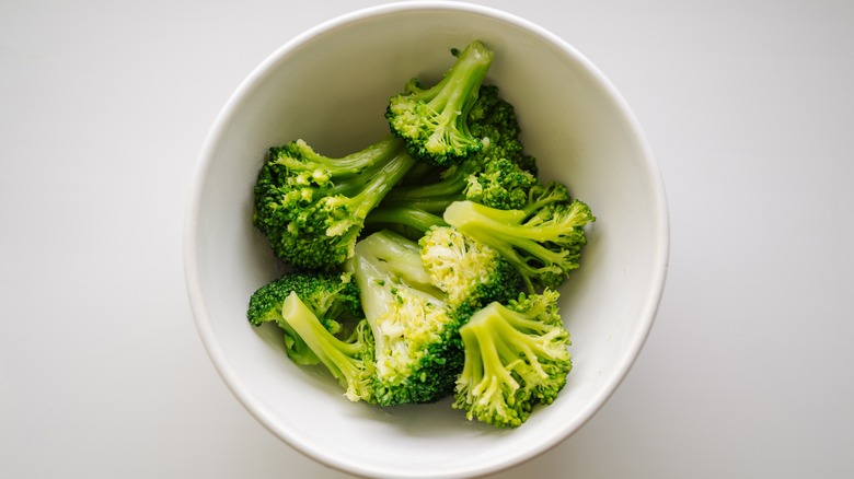White bowl with steamed broccoli