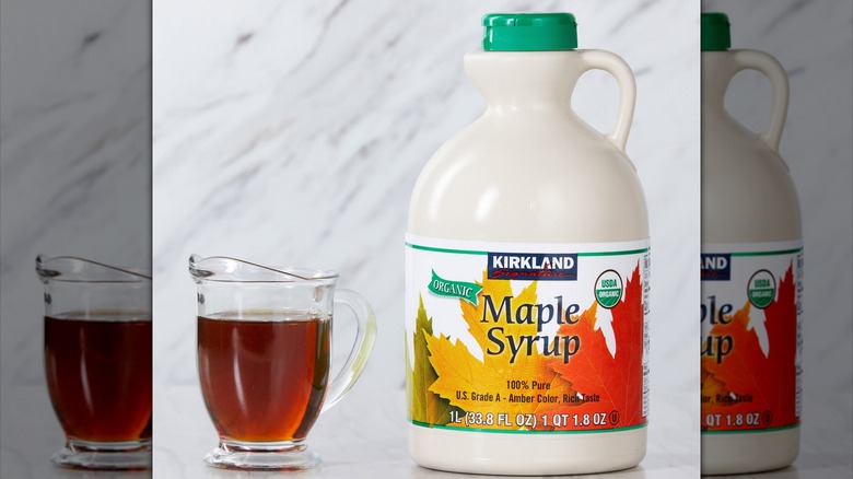 Jugs of maple syrup sit in a Sam's Club.
