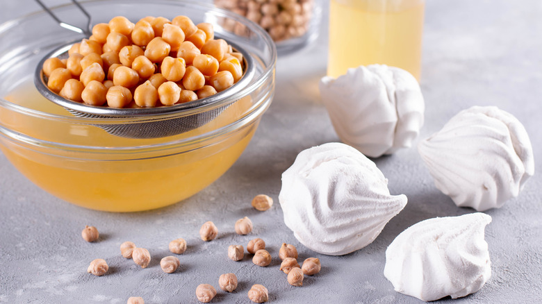 Aquafaba meringues with bowl of chickpea water