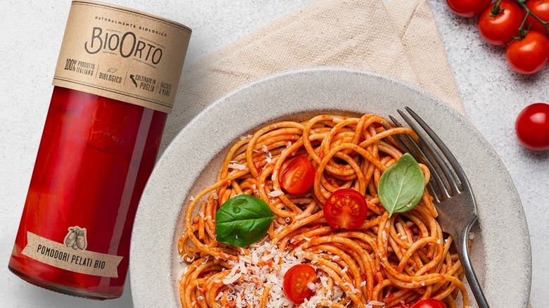 Glass jar of Bio Orto pomodori sauce next to spaghetti pomodoro