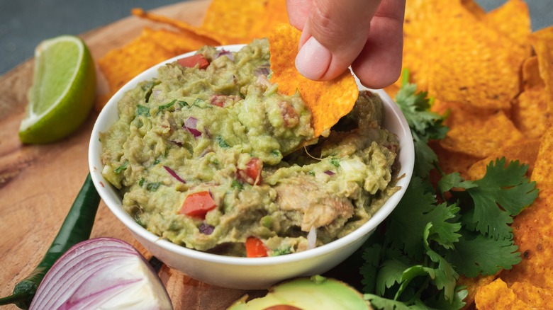 Dipping chip in guacamole