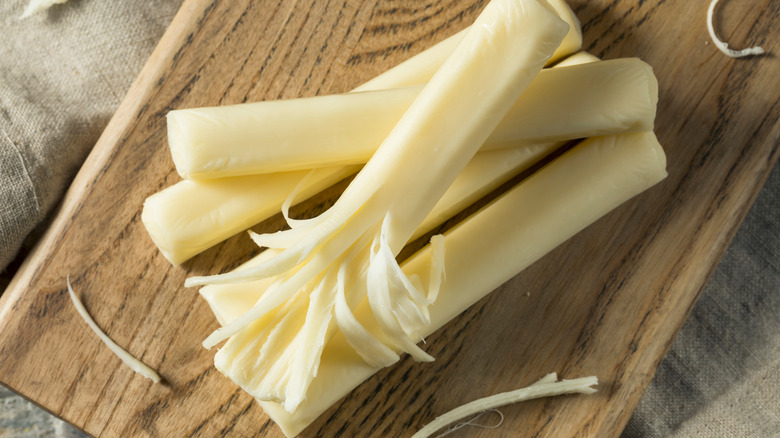 string cheese on cutting board