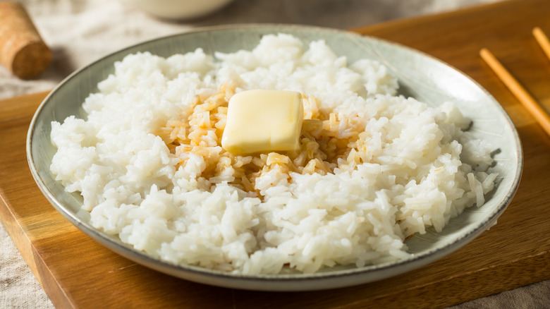 Bowl of white rice with soy sauce and a pat of butter
