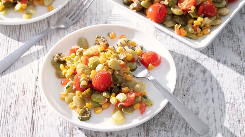 Plate of succotash with lima beans, corn, and tomatoes