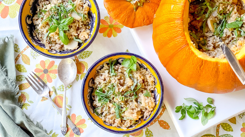 Baked pumpkin stuffed with rice in bowls