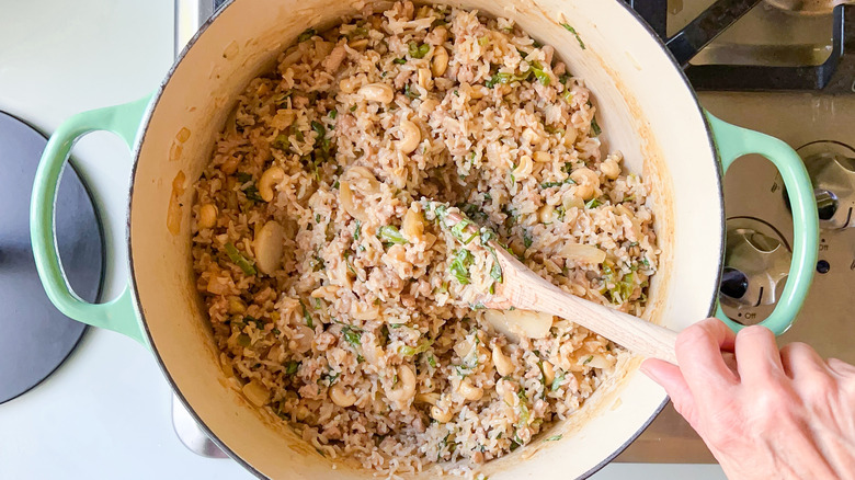 Rice with pork and aromatic vegetables in pot