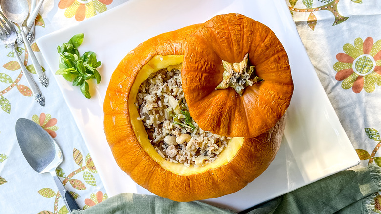 Pumpkin stuffed with aromatic rice on platter