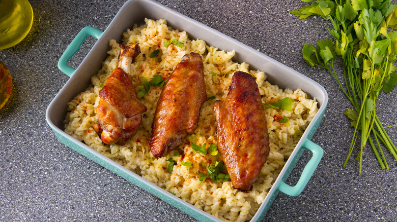 Turkey wings served over pasta in a casserole dish