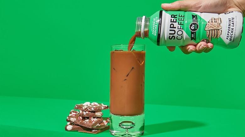 Bottle of Super Coffee peppermint mocha latte being poured into a glass