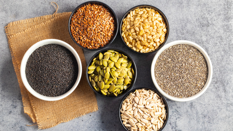 A variety of different edible seeds in bowls