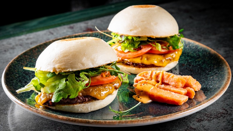 Burgers on bao buns and sweet potato fries