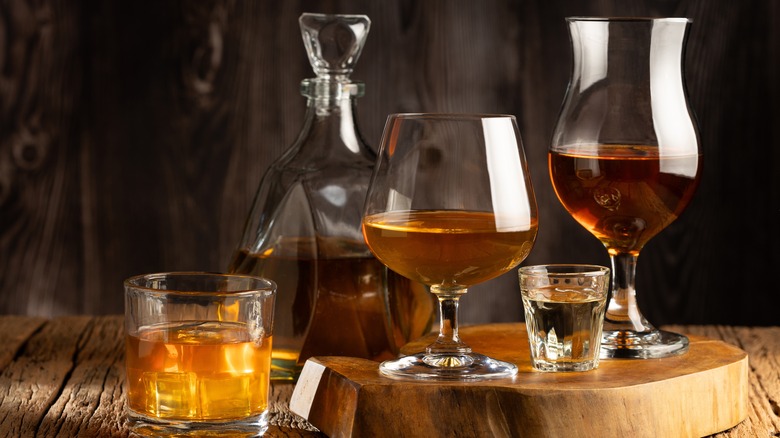 Various glasses of dark liquor
