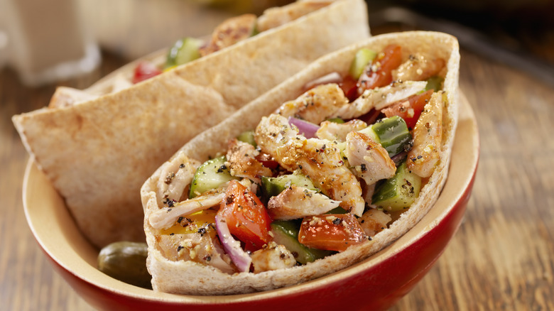 pita filled with salad and chicken