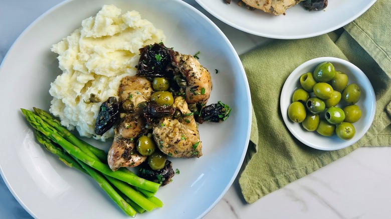 chicken Marbella potatoes asparagus