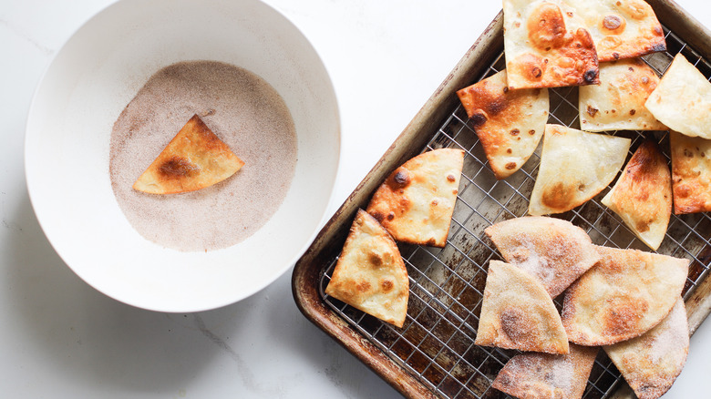 Tossing sopapillas in sugar