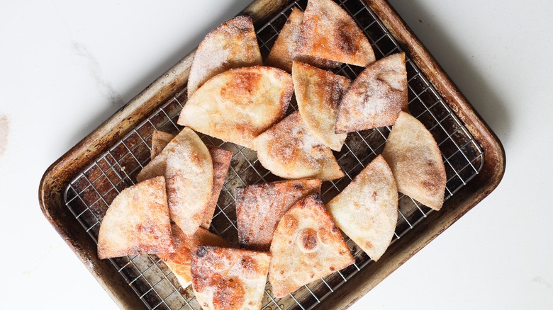 sopapillas with honey on tray