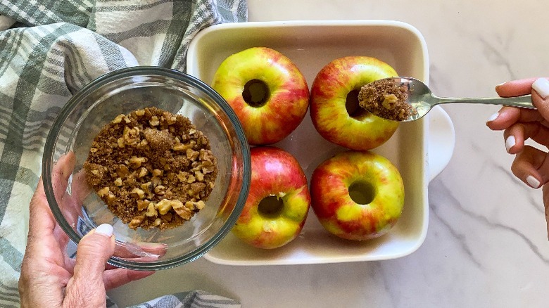 filling apples with cinnamon mixture