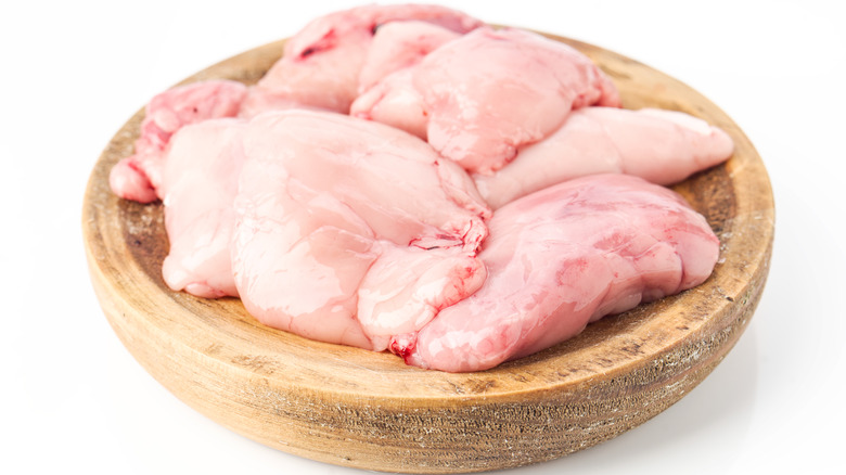 Sweetbreads on wooden dish
