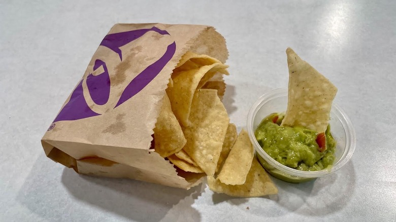 Taco Bell's Chips and Guacamole on a white table top