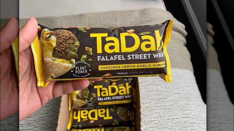 Someone holding TaDah wraps 