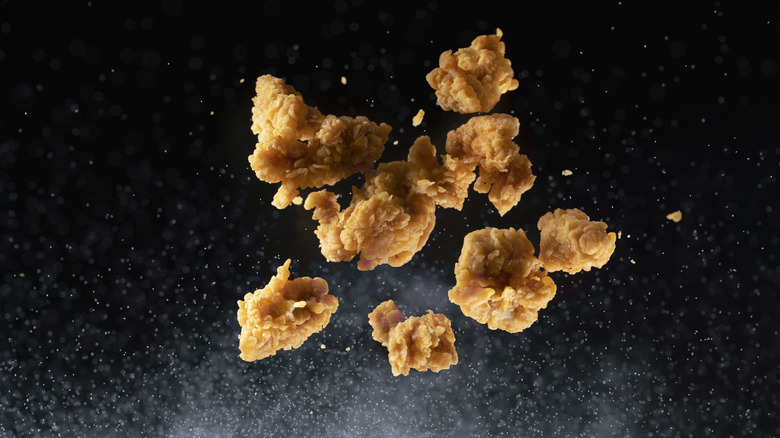 popcorn chicken being tossed