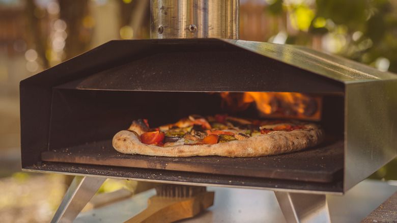 pizza baked in outdoor oven