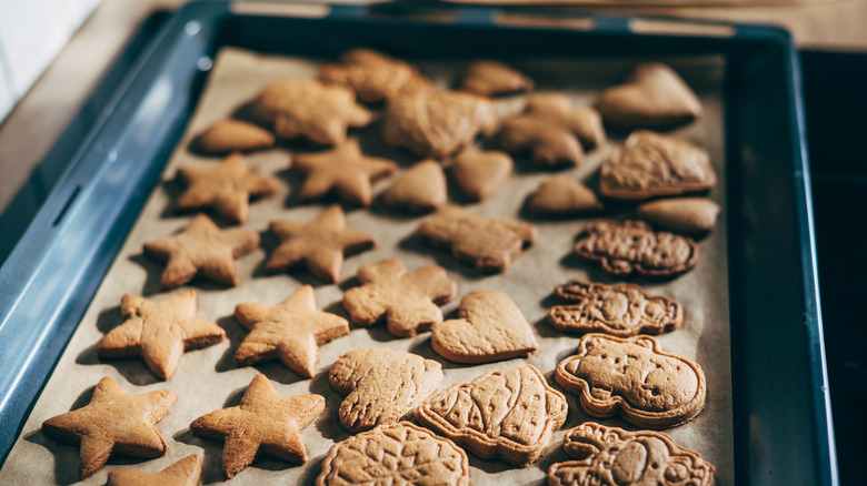 Close up of a batch of cookies being removed from the oven