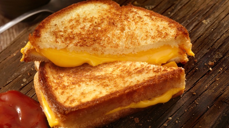 A halved grilled cheese sandwich.