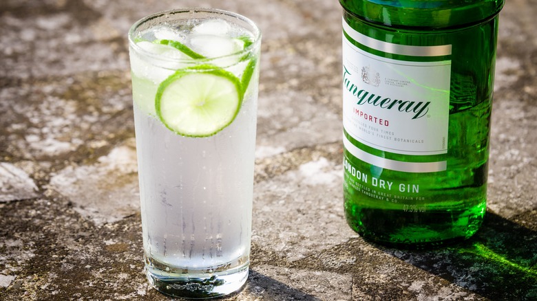 Bottle of Tanqueray and a gin and tonic