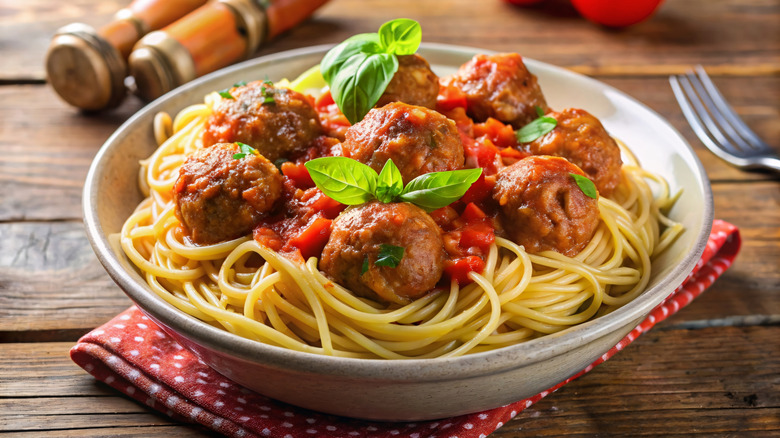 served bowl of spaghetti and meatballs