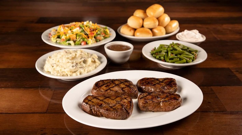 A huge barbecue meal with sides