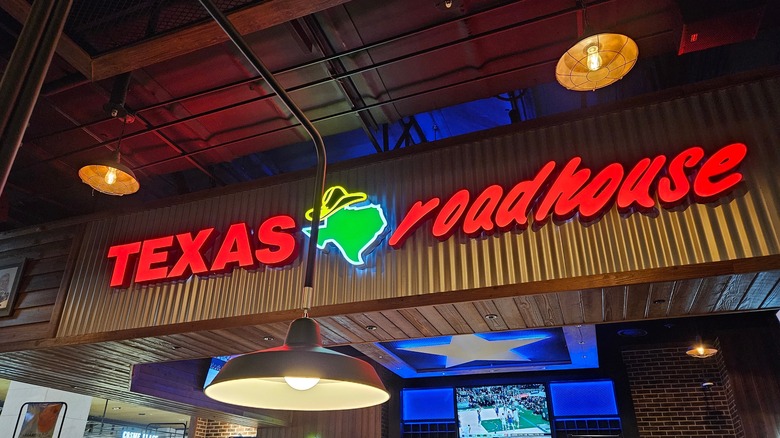 Texas Roadhouse restaurant sign lit up
