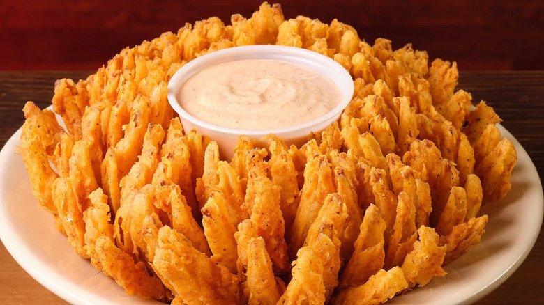 golden-fried onion appetizer with dip