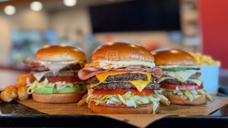 Three Jaggers burgers and sides on tray