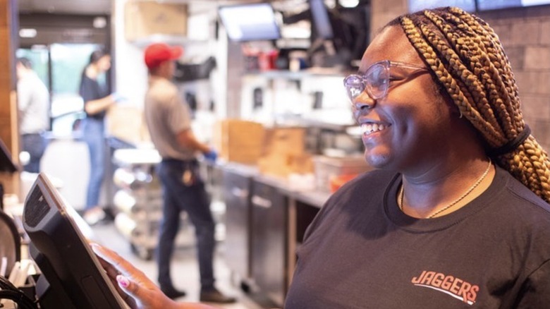 Jaggers employee takes order as others work in background