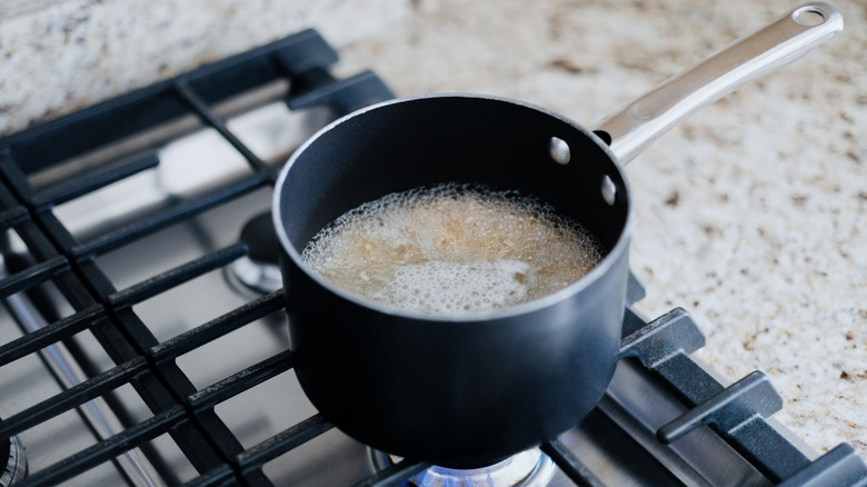 Rice boiling in pot on the stove
