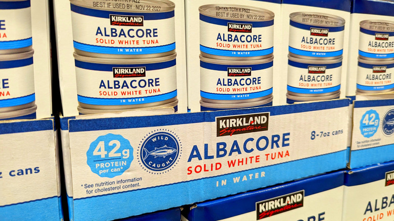 Stacked cases of Kirkland Signature canned tuna