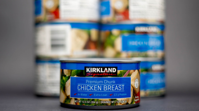 Can of Kirkland Signature chunk chicken breast with more in the background