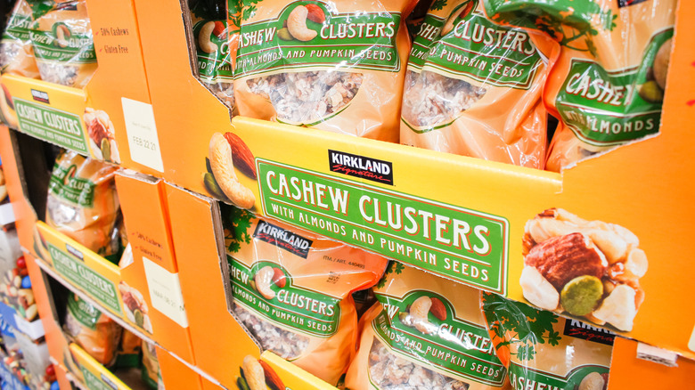 Display cases stocked with bags of Kirkland Signature Cashew Clusters