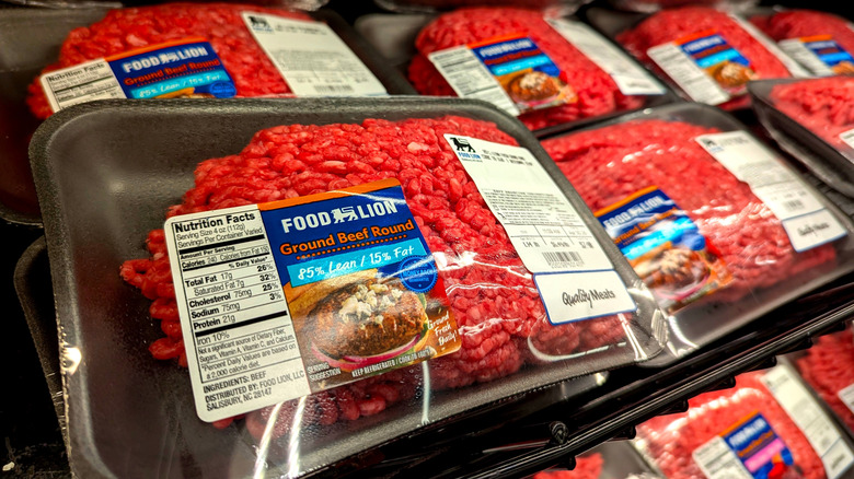 Packages of cherry-red ground beef in supermarket