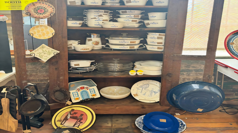 Vintage casserole dishes on display in secondhand store