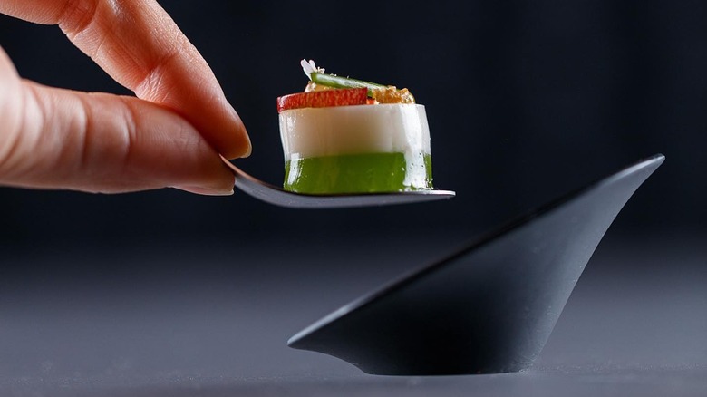 chef plating single bite of food
