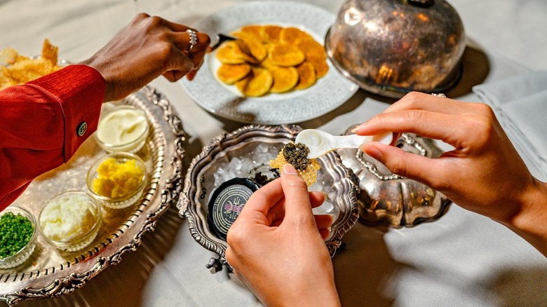 diners sampling caviar and snacks