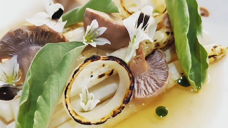 asparagus and mushroom dish with flowers