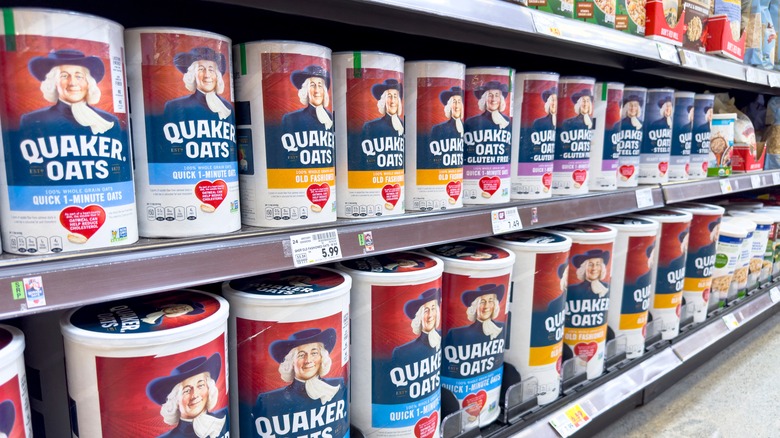 Containers of Quaker items in grocery store aisle.