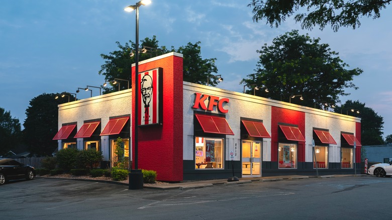 The exterior of KFC lit up in the evening
