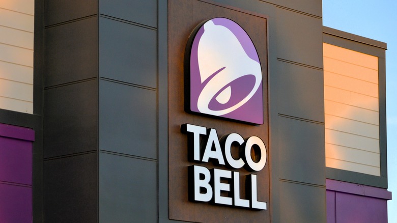The Taco Bell sign on the exterior of the building